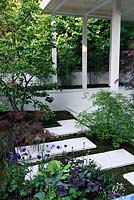 Arita. Japanese style garden with porcelain stepping stones and outdoor shelter 