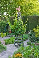 Potager / kitchen garden with wooden trellis topped with a cockerel. Les Confines, Provence, France