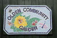 Mosaic plaque or sign on the door to the Olden Community Garden, Highbury, London Borough of Islington 