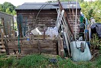 Recycled items stored behind an allotment shed, Golf Course Allotments, London Borough of Haringey.