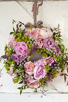 Summer wreath with roses, peonies, euphorbia, cow parsley and clematis