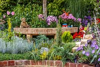 Colourful planting and children's toys from different eras - The NSPCC Legacy Garden, RHS Hampton Court Flower Show 2014