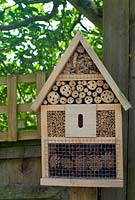 Insect house on wooden fence