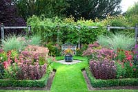 Formal garden. Sedum 'Bon Bon', Penstemon 'Firebird', Dahlia 'Magenta Star', Miscanthus 'Morning Light' Helenium 'Red Jewel'