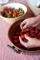 Making rosehip jam. Top and tail the hips 