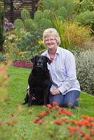 Garden owner Helen Boothman, with her dog Lucy. September, Autumn 2014.