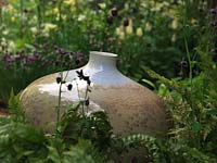 Resting in herbaceous bed, lovely pot with crystalline glaze by potter John Stroomer.