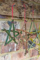 A variety of festive stars made from various tree and shrub cuttings. Spindle, Broom and Prunus with Lichen. 