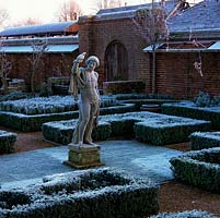 At dawn, C18 stone Apollo by Peter Van Baurscheit overlooks formal parterre of low, clipped box hedges