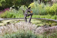 The Pond with dragon sculpture - Knoll Gardens, Wimborne Minster, Dorset. Designed and owned by Neil Lucas. September