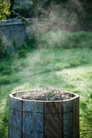 Steam rising from hot compost heap