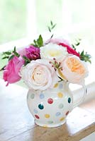 Pink, cream and peach roses in an  arrangement. Cut flower roses bred by David Austin Roses