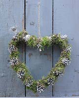 Heart wreath with moss and pine cones