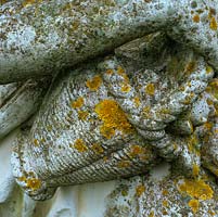 Lichen growth is well developed on this 50-year-old, reconstituted stone-and-marble statue.