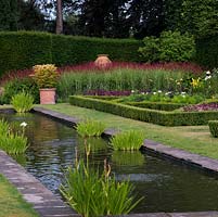 The Pool Garden at Abbeywood. A long reflecting pool is surrounded by formal box borders 
