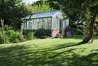 Greenhouse in the kitchen garden. Caervallack Farm, nr Helston, Cornwall, UK