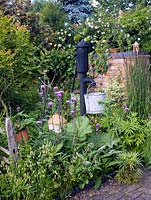 Victoria water pump in mixed vegetable and flower garden