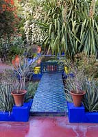 Jardin Majorelle, Yves Saint Laurent garden, tiled path leading to the water lily pond