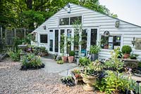 Shop surrounded by plants for sale at King John's Nursery, Etchingham, East Sussex, UK