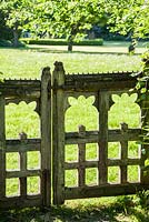 Decorative rustic wooden gate. King John's Nursery, Etchingham, East Sussex, UK