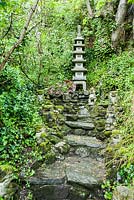 To-Doro, stupa lantern, set on a slope above the garden with Guardian lions below. The Japanese Garden and Bonsai Nursery, St.Mawgan, nr Newquay, Cornwall