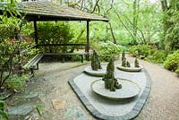 Mountain-like stones set into gravel bowls. The Japanese Garden and Bonsai Nursery, St.Mawgan, nr Newquay, Cornwall
