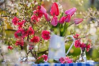 Floral arrangements of tulips and Japanese quince.