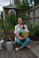 Nicola Stocken, photographer and writer, with the harvest from her vegetable bed in it's first year.