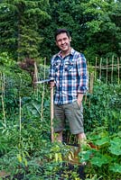 James Wong, ethnobotanist, TV presenter, author and celebrity gardener, in his own small vegetable patch where he experiments with unusual edible plants.