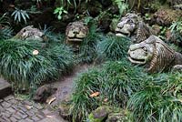 Lion sculptures amongst carex at Monte Palace Tropical Garden, Madeira