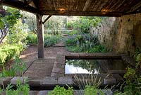 A Perfumer's Garden in Grasse. Recreation of Lavoir building in natural wild garden. 