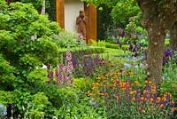 The Morgan Stanley Healthy Cities Garden. Bronze sculpture by Anna Gillespie. Buxus - Box - hedging with Salvia nemorosa cv, Verbascum cv, Geum, Camassia, Cirsium rivulare 'Atropurpureum'