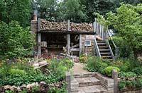 Rustic potting shed - Artisan Garden - A Trugmaker's Garden. RHS Chelsea Flower Show, 2015