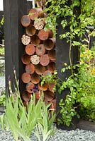 Sculpture made of recycled rusty tin cans. The Great Chelsea Garden Challenge. RHS Chelsea Flower Show 2015.