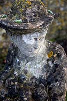One of Simon Verity's sculptures, weathered and aged with moss and lichen