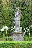 Statue surrounded by Allium 'Mount Everest' and Box hedging - Ammerdown House, Somerset