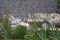 The sunken seating area shielded by a border of Verbena bonariensis, Calamagrostis x acutiflora 'Karl Foerster' and Buxus sempervirens balls used to give a sense of privacy