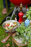 Summer salad on garden table 