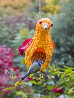 A Gourd Bird Feeder made from a Gourd and natural materials, designed to look like a duck, chicken or bird