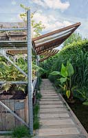 Wooden canopy. Path with wooden planks.  Le Collectionneur de L Ombre. Prize for designs and innovative idea.  Chaumont sur Loire gardenfestival 2015