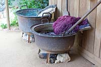 Metal cauldron - Kettles in the garden used to dye wool with plant colouring. Chaumont sur Loire. France. 
