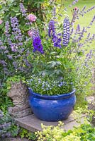 Blue gazed container with Lupinus 'The Governor' - Band of Nobles Series, Isotoma axillaris 'Blue Star', Delphinium 'Magic Fountains' and Lobelia 'Trailing Light Blue'
