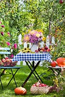 Floral and harvest display of Asters, Dahlias, Sunflowers and Apples. Harvest Time.