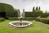 View from the Fountain Garden through the Lemon Garden. Hedges of box. Villa La Foce, near Chianciano Terme, Siena, Tuscany, Italy. October. 