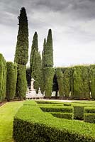 The Lower Garden. Box hedges backed by Cupressus sempervirens. Pool and statue. Villa La Foce, near Chianciano Terme, Siena, Tuscany, Italy. October. 