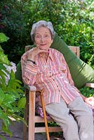 Beth Chatto, 91, sitting on her terrace in the shade of a Magnolia soulangeana which she planted as a tiny sapling, some 60 years previously.