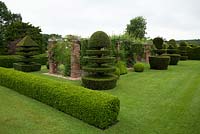 Topiary and brick rose pergola at Felley Priory, Underwood, Nottingham.
