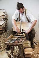 Charlie Groves making a traditional Sussex trug. Pinning each willow board in place with cut copper tacks.