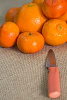 Materials required are shop bought oranges and a sharp knife