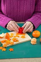 Use the star shape cutter on the orange peel to create small orange stars
